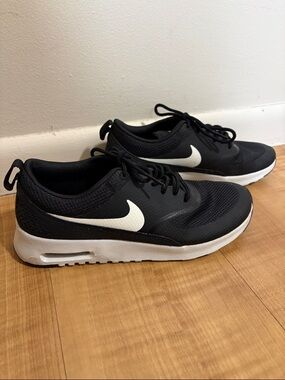 Women’s Nike Black Sneakers with White Swoosh